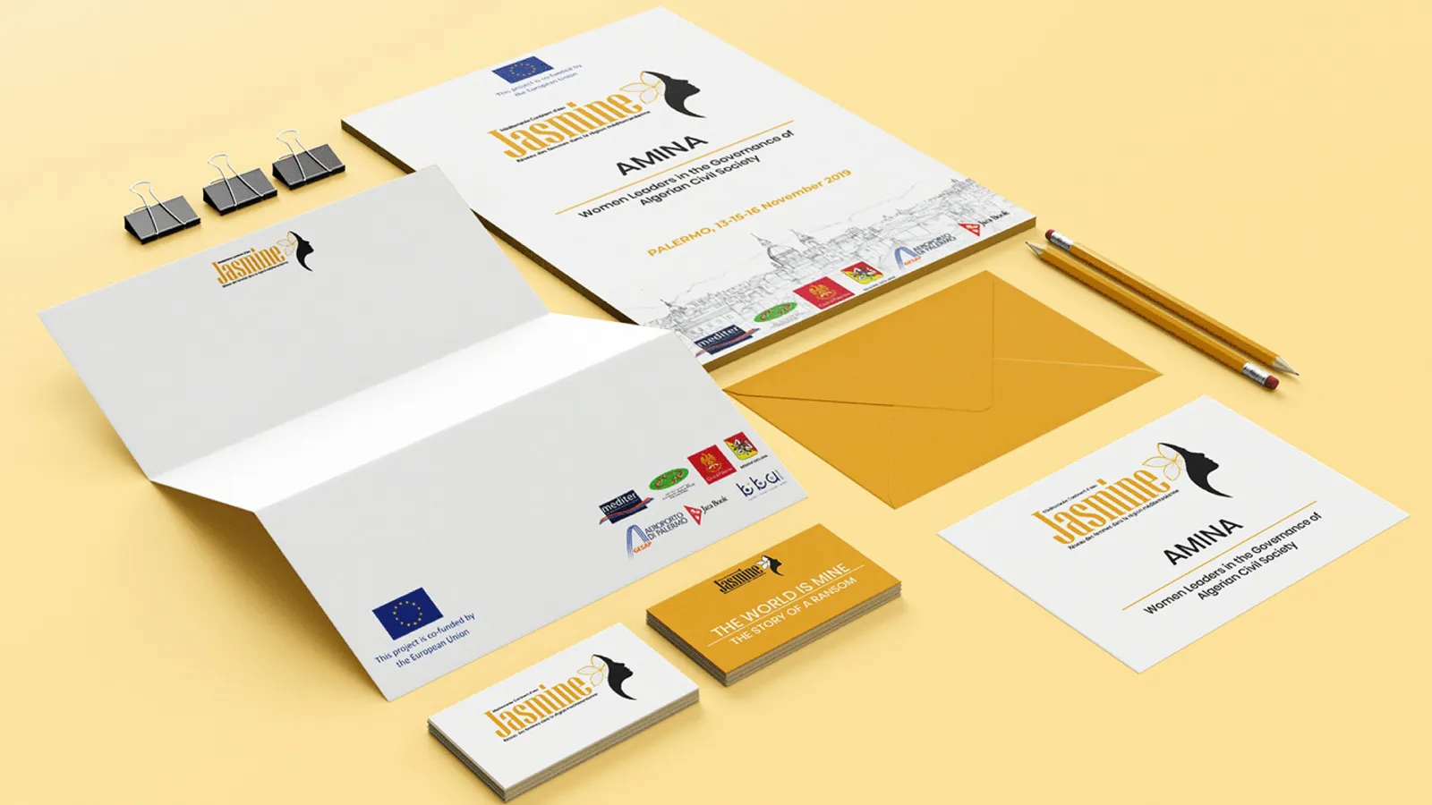 AMINA stationery: letterhead, envelopes, business cards and a pen
